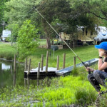 Fishing on the lake nearby campground in the Smoky Mountains